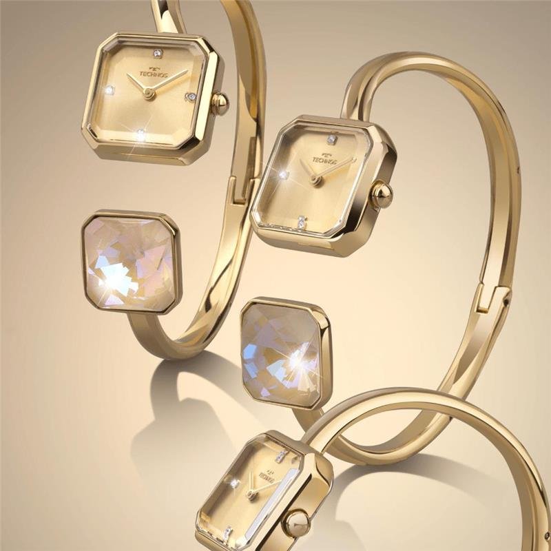 RELOGIO TECHNOS FEMININO CRYSTAL DOURADO AÇO BRACELETE COM CRISTAL SOLITÁRIO DE ORIGEM AUSTRÍACA